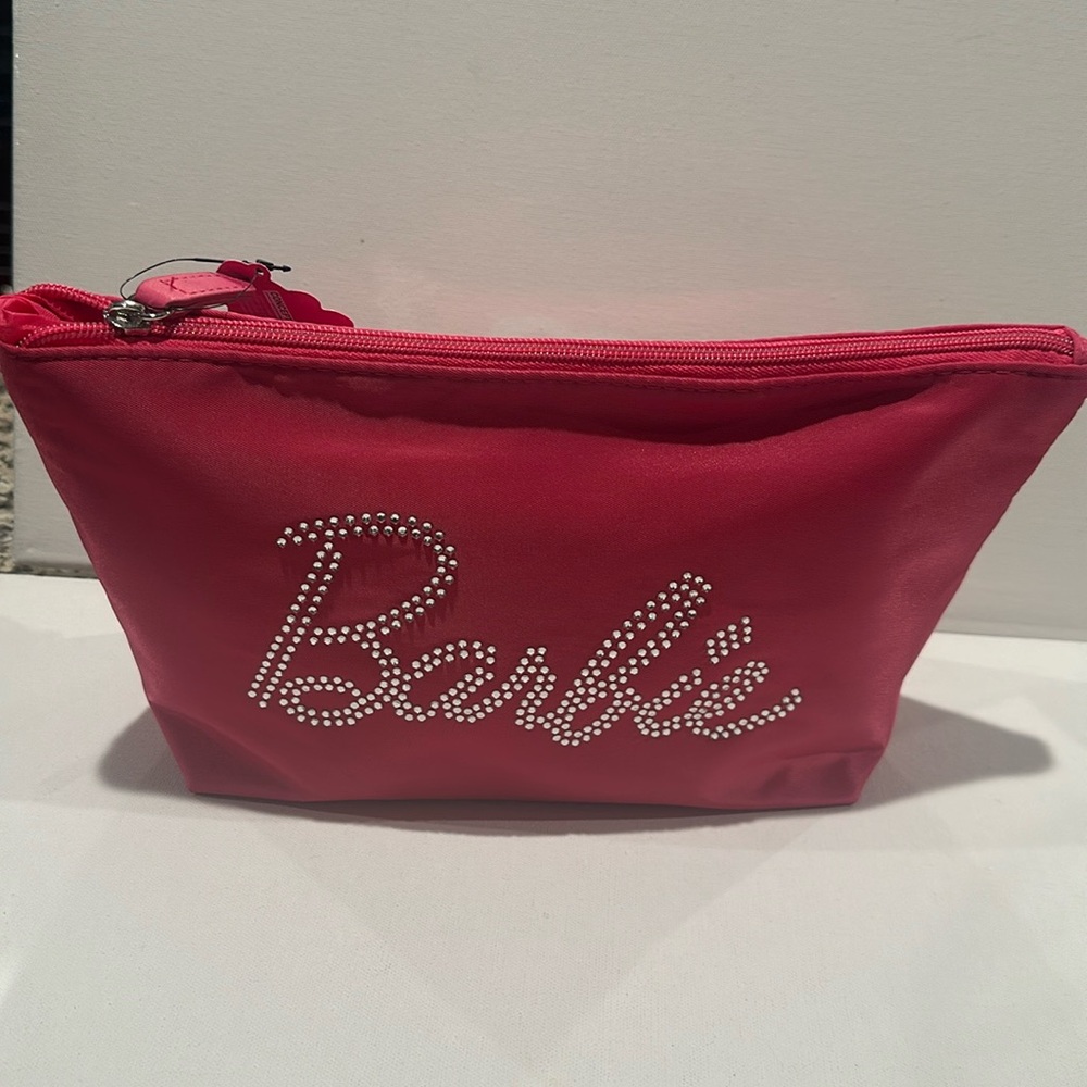 NWT Barbie Pink waterproof Cosmetics Pouch with zipper closure.